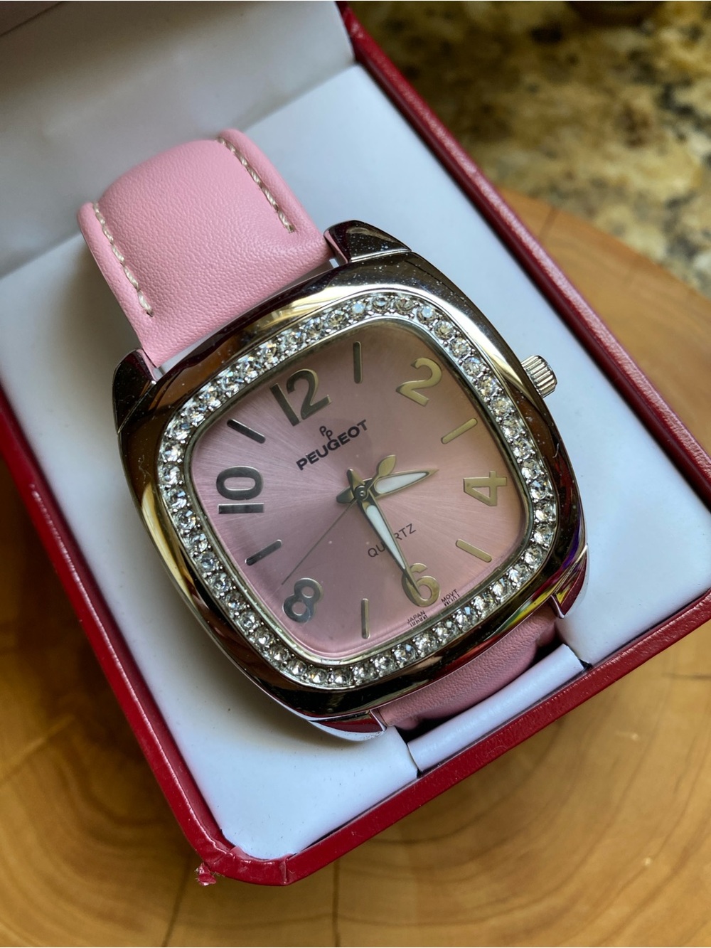 Peugeot oversized pink watch with rhinestones bezel. New in box.